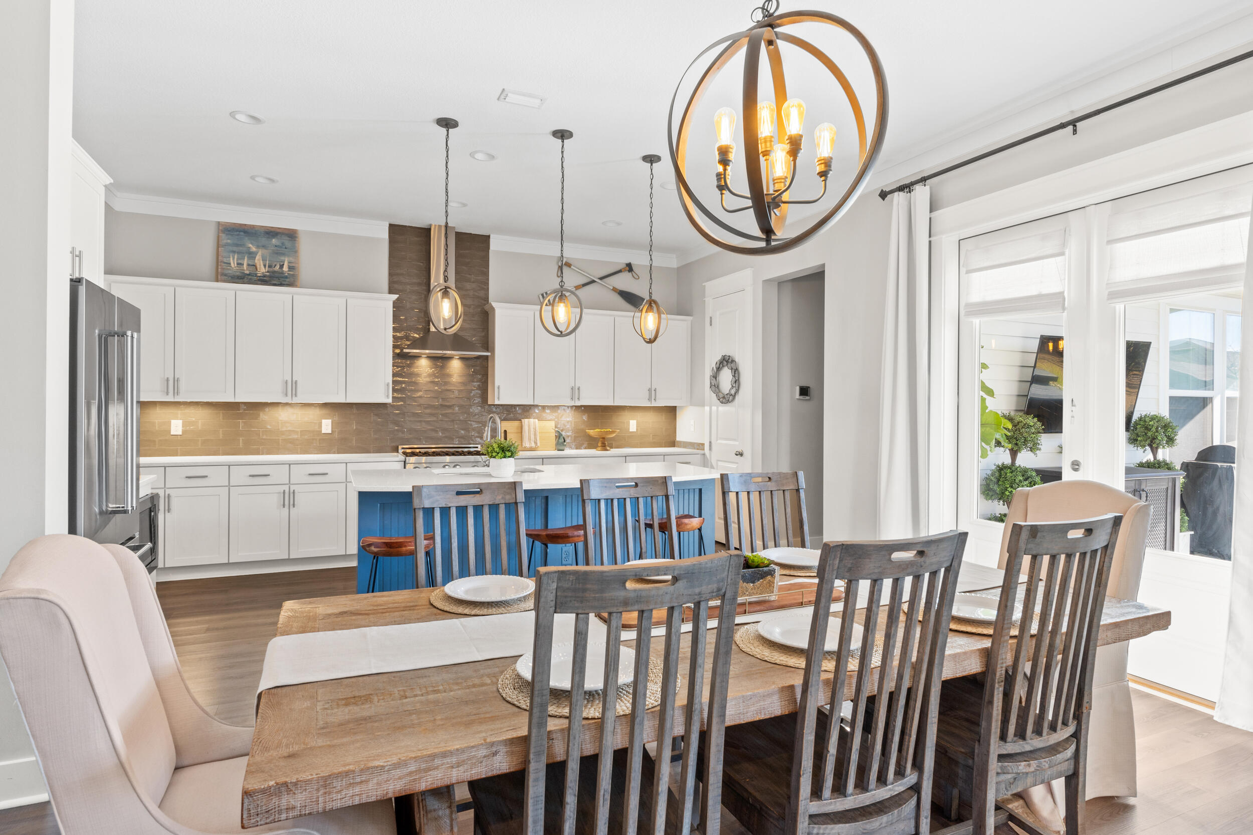 1313 North Discovery Loop Panama City, FL 32405 - Photo 8 of 50 a very nice looking dining room with kitchen island furniture a chandelier and a view of kitchen