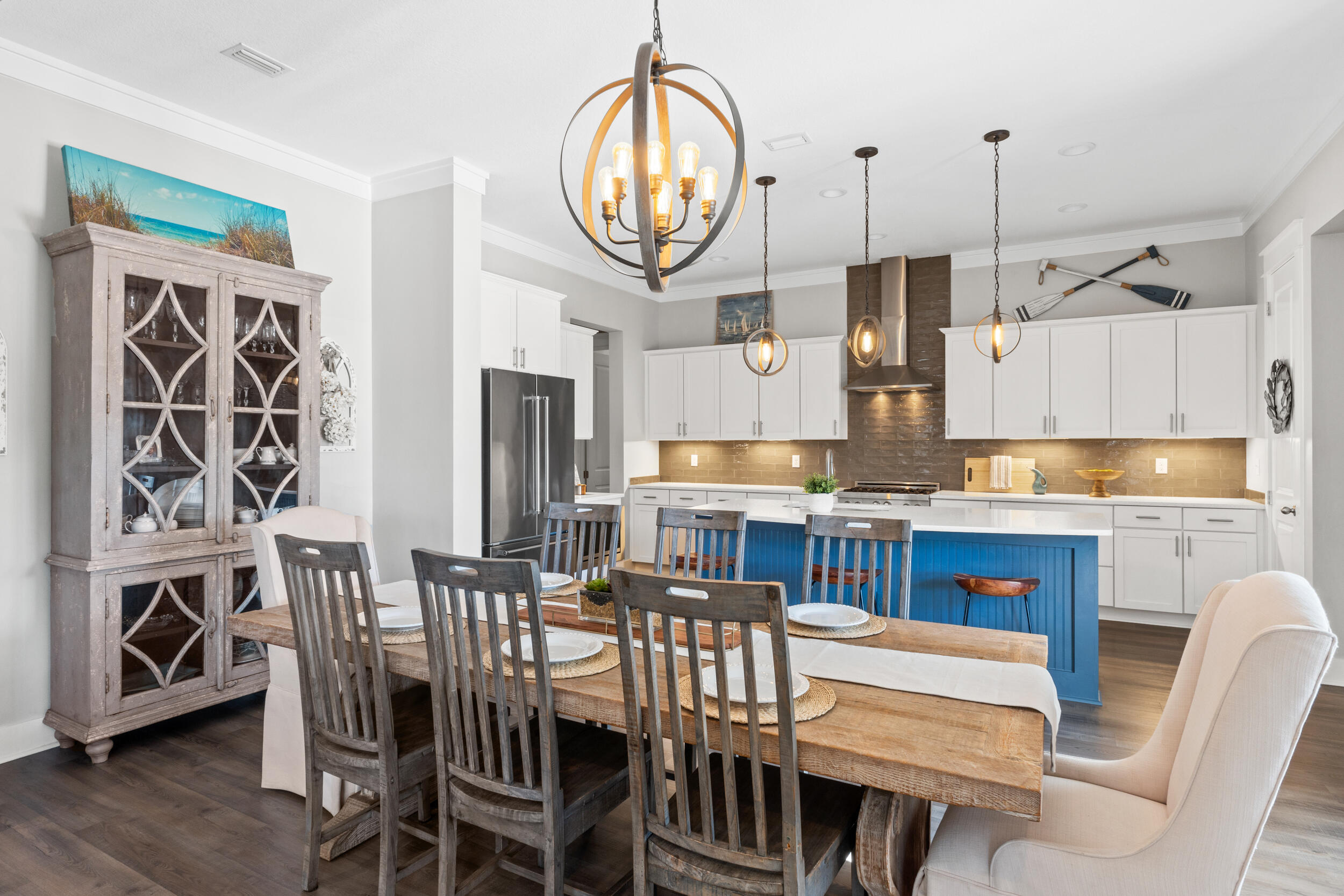 1313 North Discovery Loop Panama City, FL 32405 - Photo 9 of 50 a dining room with furniture a rug and a chandelier