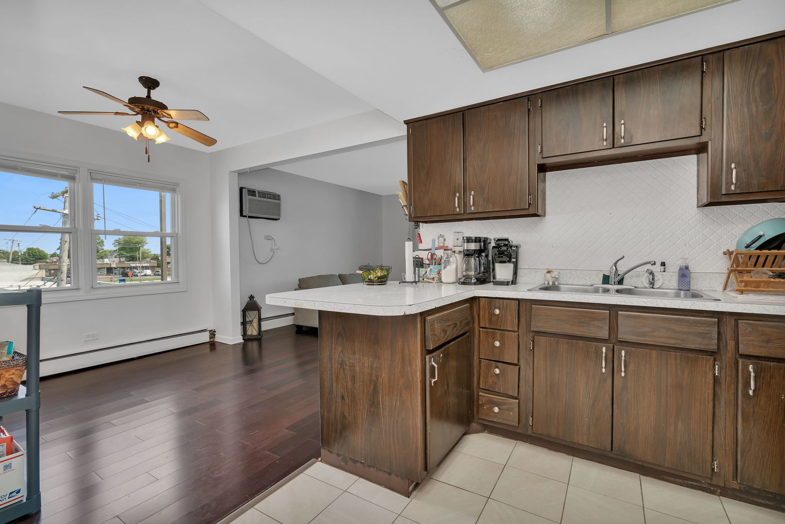 8010 West 84th Street Justice, IL 60458 - Photo 14 of 32 a kitchen with a sink cabinets and window