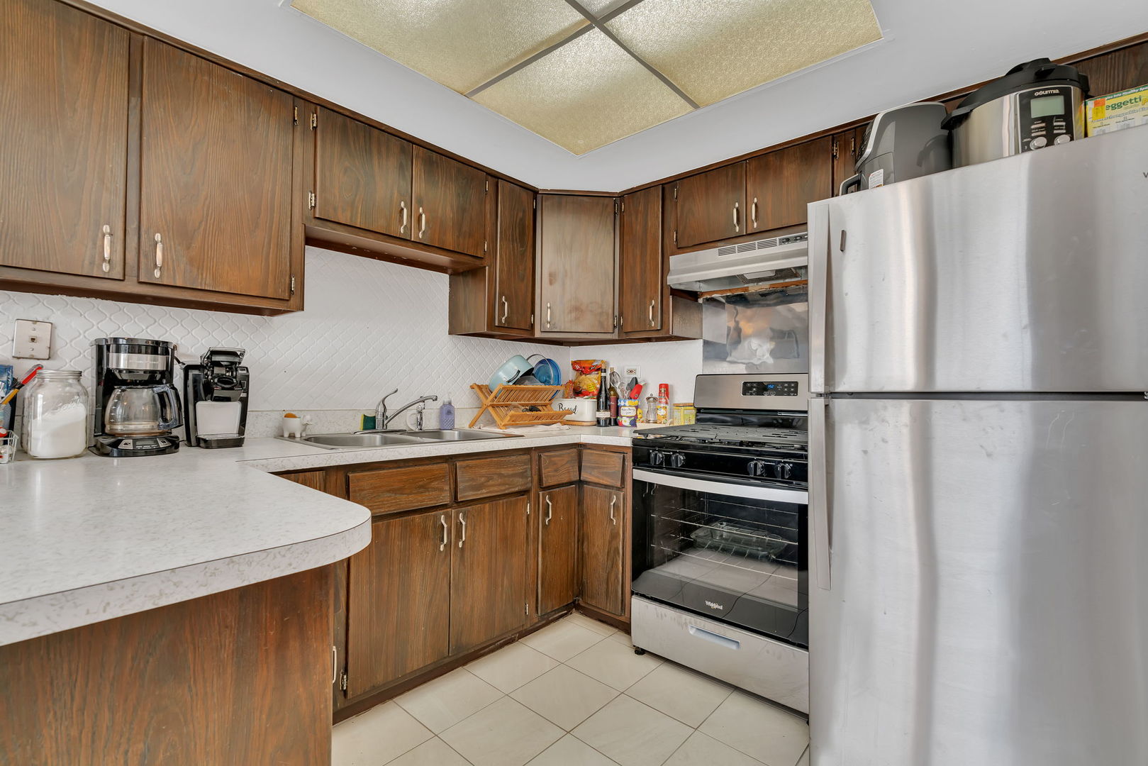 8010 West 84th Street Justice, IL 60458 - Photo 16 of 32 a kitchen with stainless steel appliances granite countertop a refrigerator and a sink