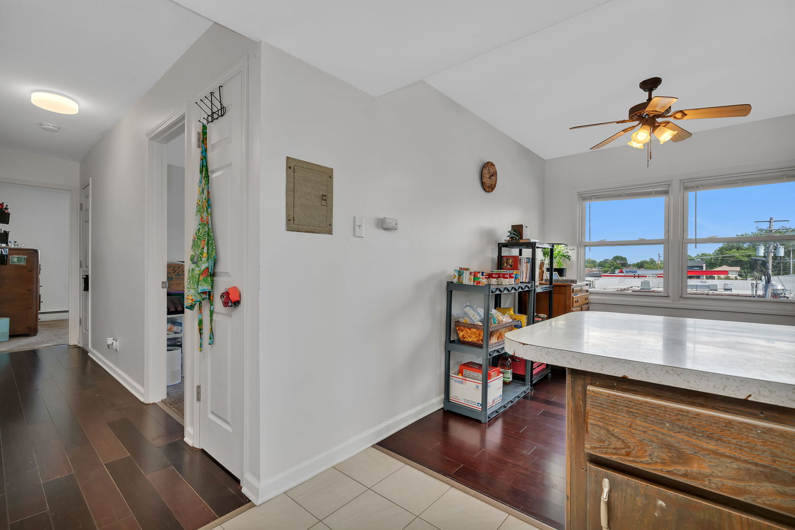 8010 West 84th Street Justice, IL 60458 - Photo 17 of 32 a room with kitchen island stainless steel appliances a dining table and chairs