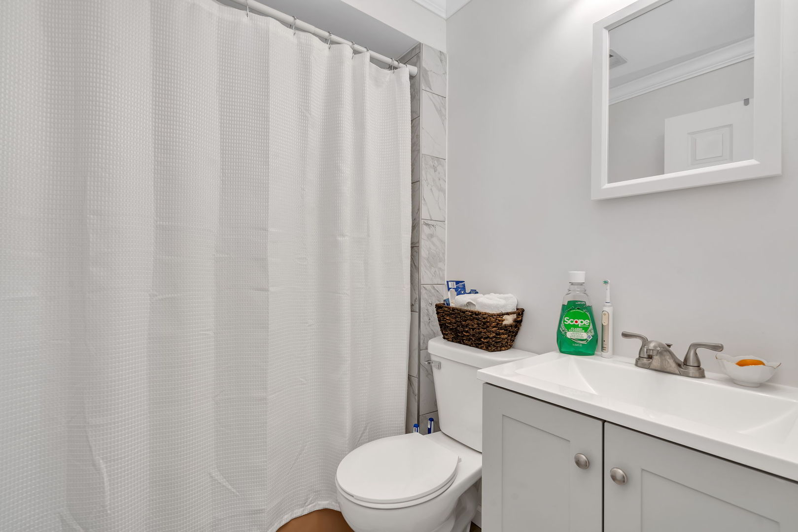 8010 West 84th Street Justice, IL 60458 - Photo 20 of 32 a bathroom with a sink a toilet and a mirror