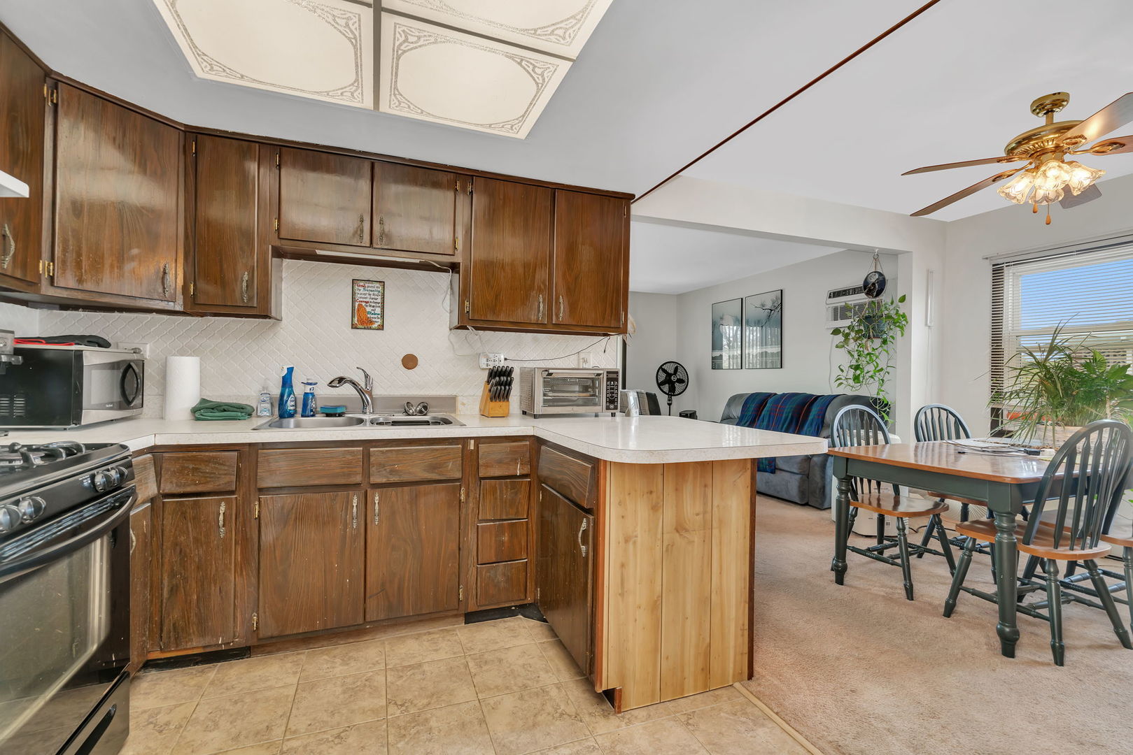 8010 West 84th Street Justice, IL 60458 - Photo 25 of 32 a kitchen with cabinets a sink and appliances