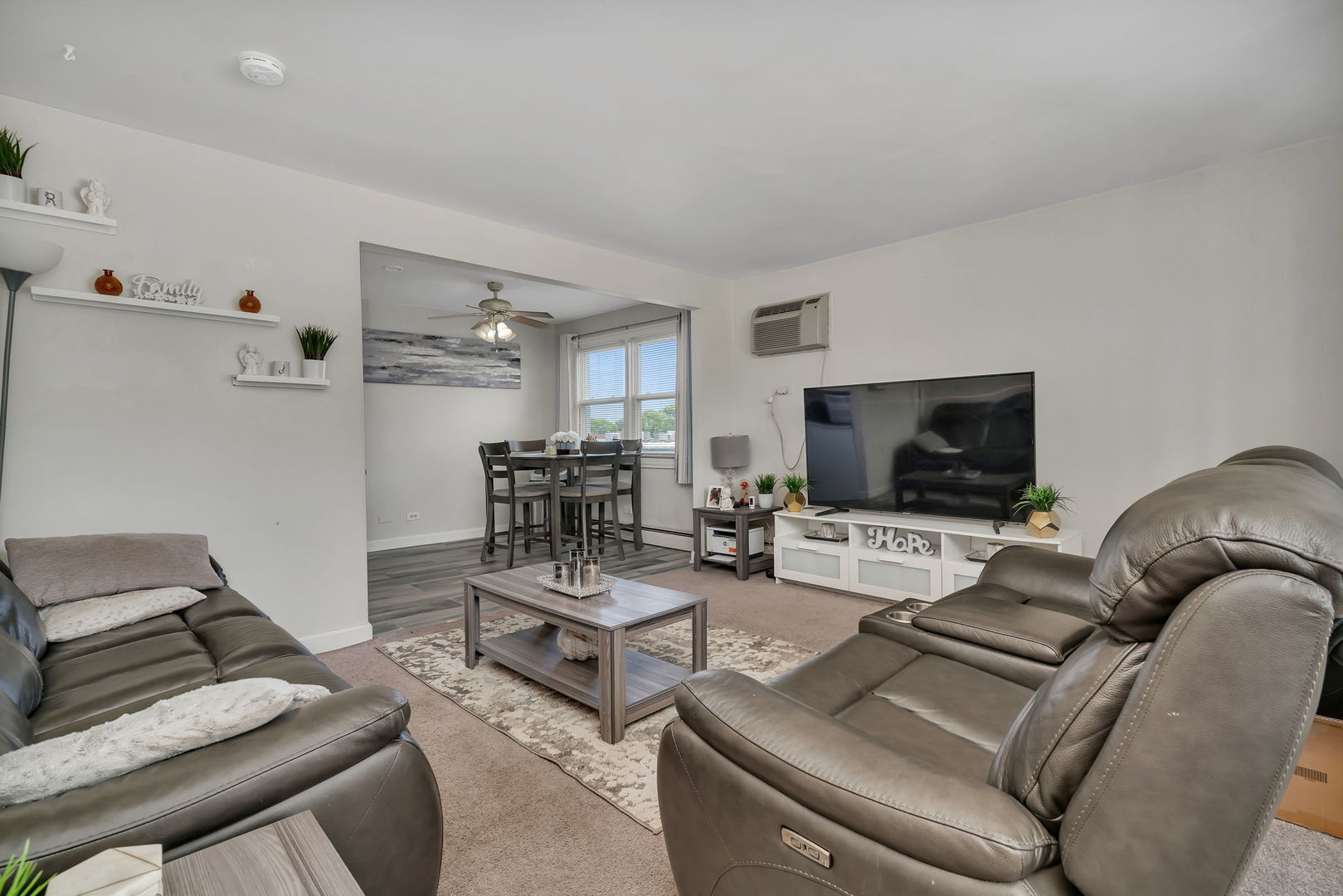 8010 West 84th Street Justice, IL 60458 - Photo 5 of 32 a living room with furniture and a flat screen tv