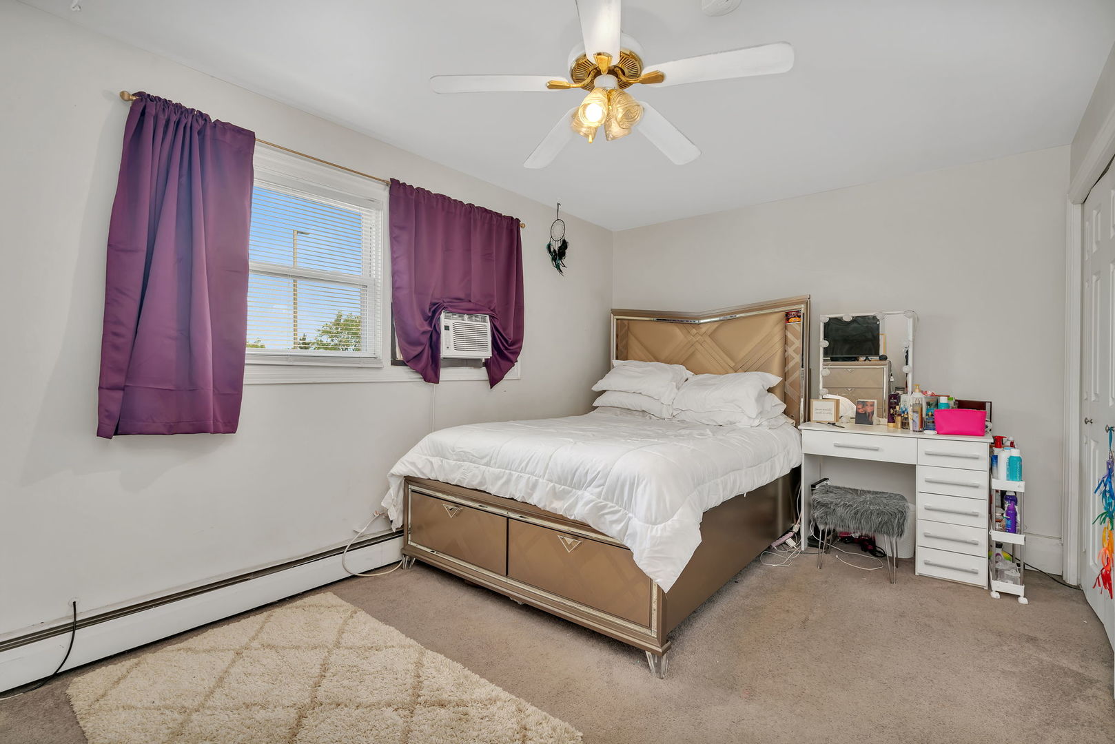 8010 West 84th Street Justice, IL 60458 - Photo 9 of 32 a bedroom with a bed and a chandelier