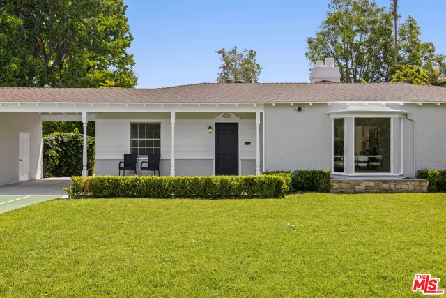 a view of a house with a garden