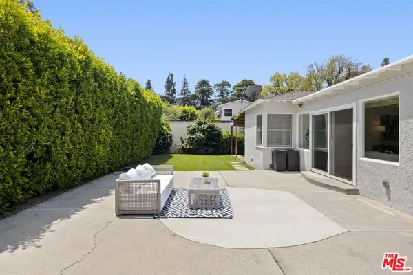 a view of a house with outdoor space porch and furniture