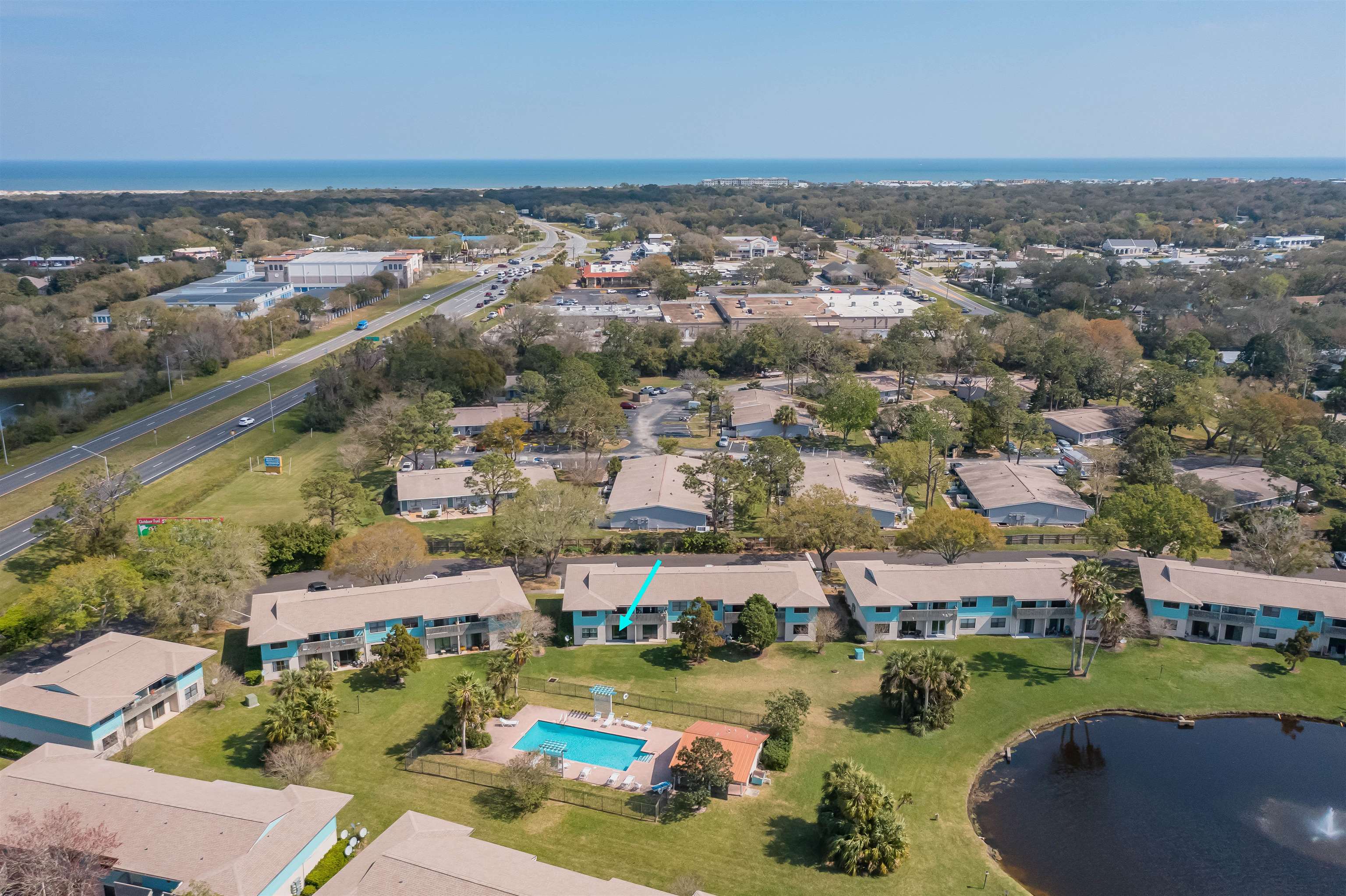 650 West Pope Road, Unit 240 St. Augustine, FL 32080 - Photo 1 of 35 an aerial view of a city with lots of residential buildings lake and ocean view