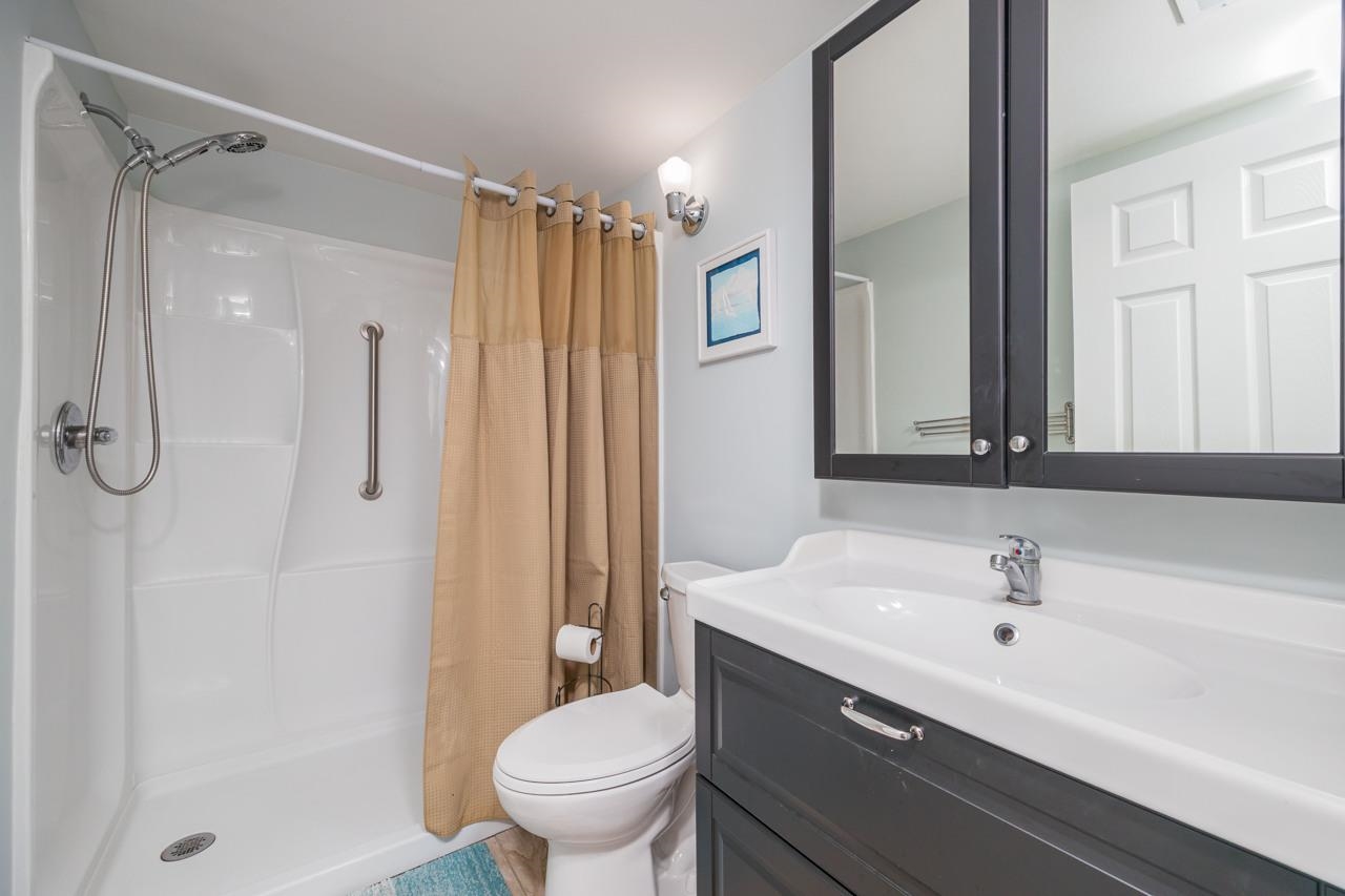 650 West Pope Road, Unit 240 St. Augustine, FL 32080 - Photo 20 of 35 a bathroom with a sink toilet and shower