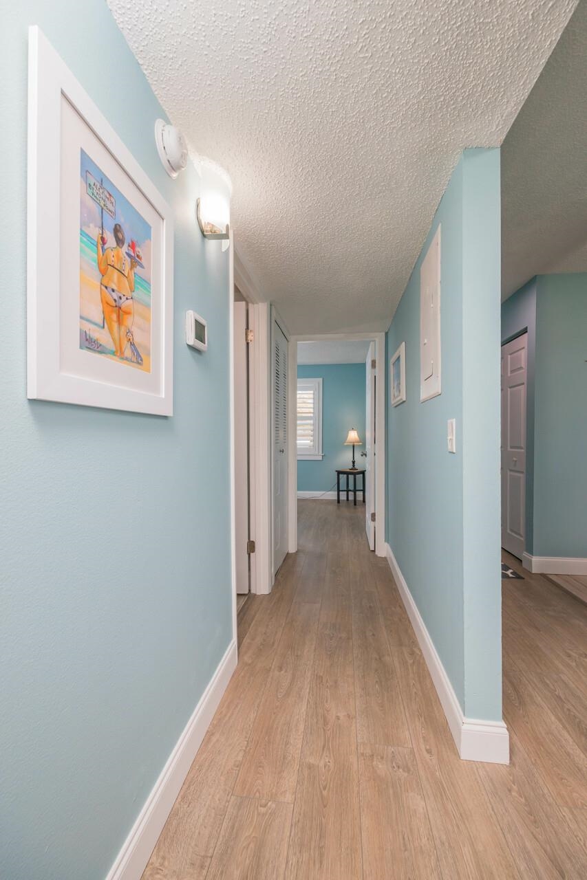 650 West Pope Road, Unit 240 St. Augustine, FL 32080 - Photo 21 of 35 a view of a hallway with wooden floor and closet