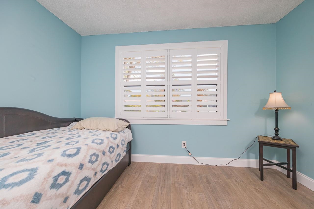 650 West Pope Road, Unit 240 St. Augustine, FL 32080 - Photo 23 of 35 a bedroom with a bed and a window