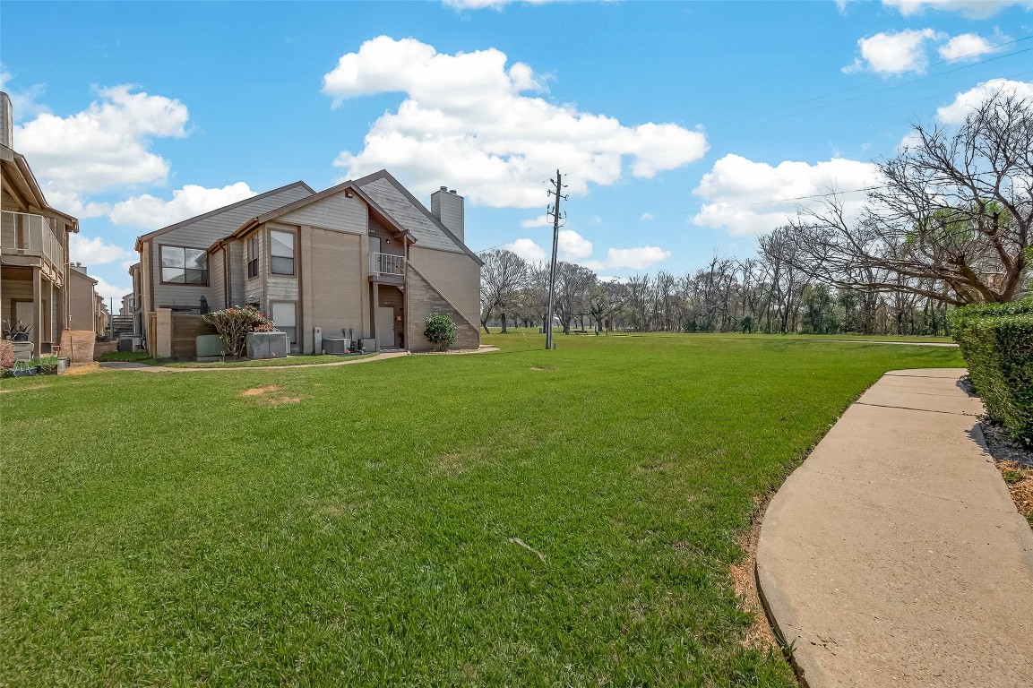 8483 Sands Point Drive Houston, TX 77036 - Photo 22 of 23 a view of a house with a yard