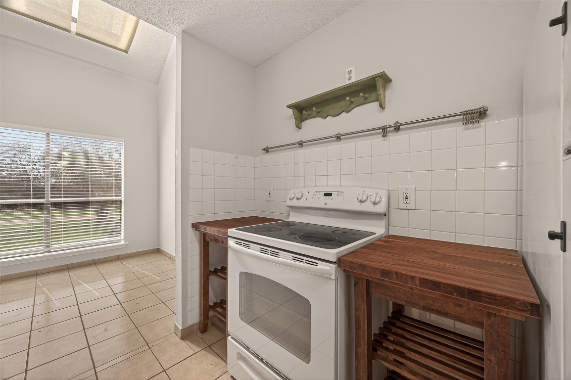 8483 Sands Point Drive Houston, TX 77036 - Photo 7 of 23 a view of a kitchen with washer and dryer