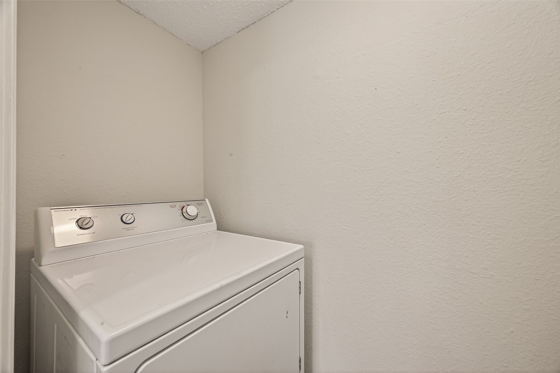 8483 Sands Point Drive Houston, TX 77036 - Photo 8 of 23 a utility room with dryer and washer