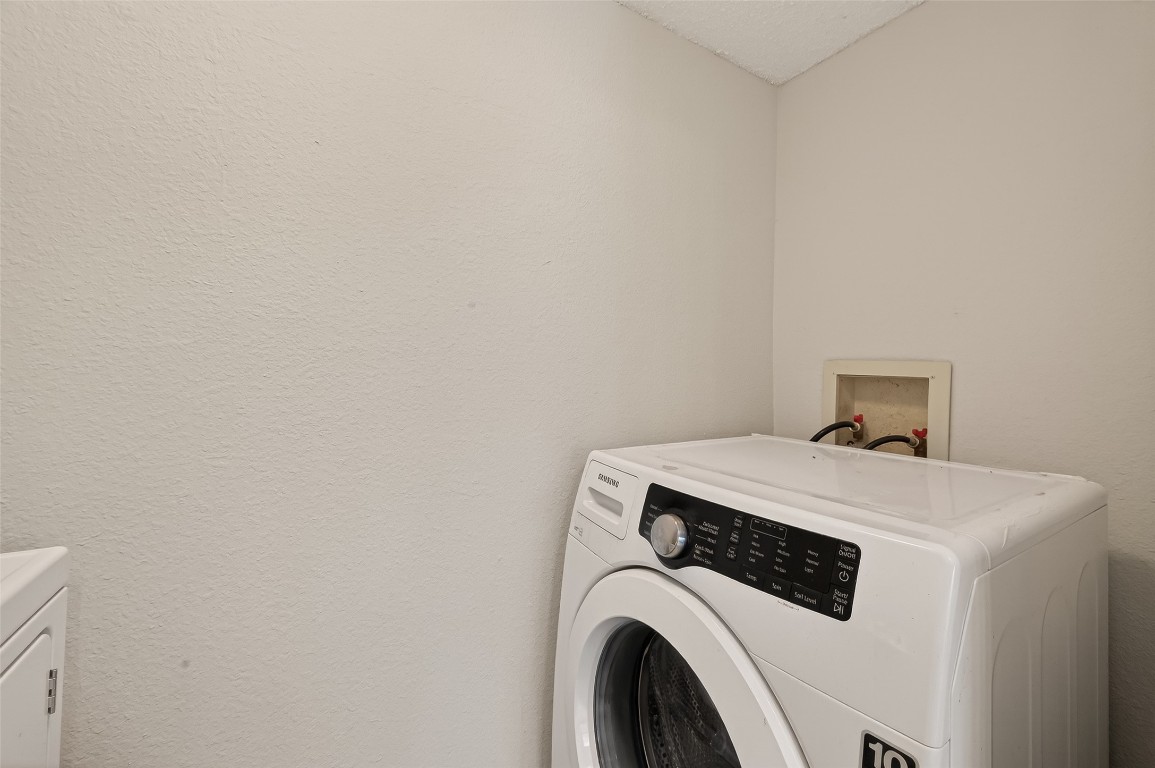 8483 Sands Point Drive Houston, TX 77036 - Photo 9 of 23 a utility room with dryer and washer