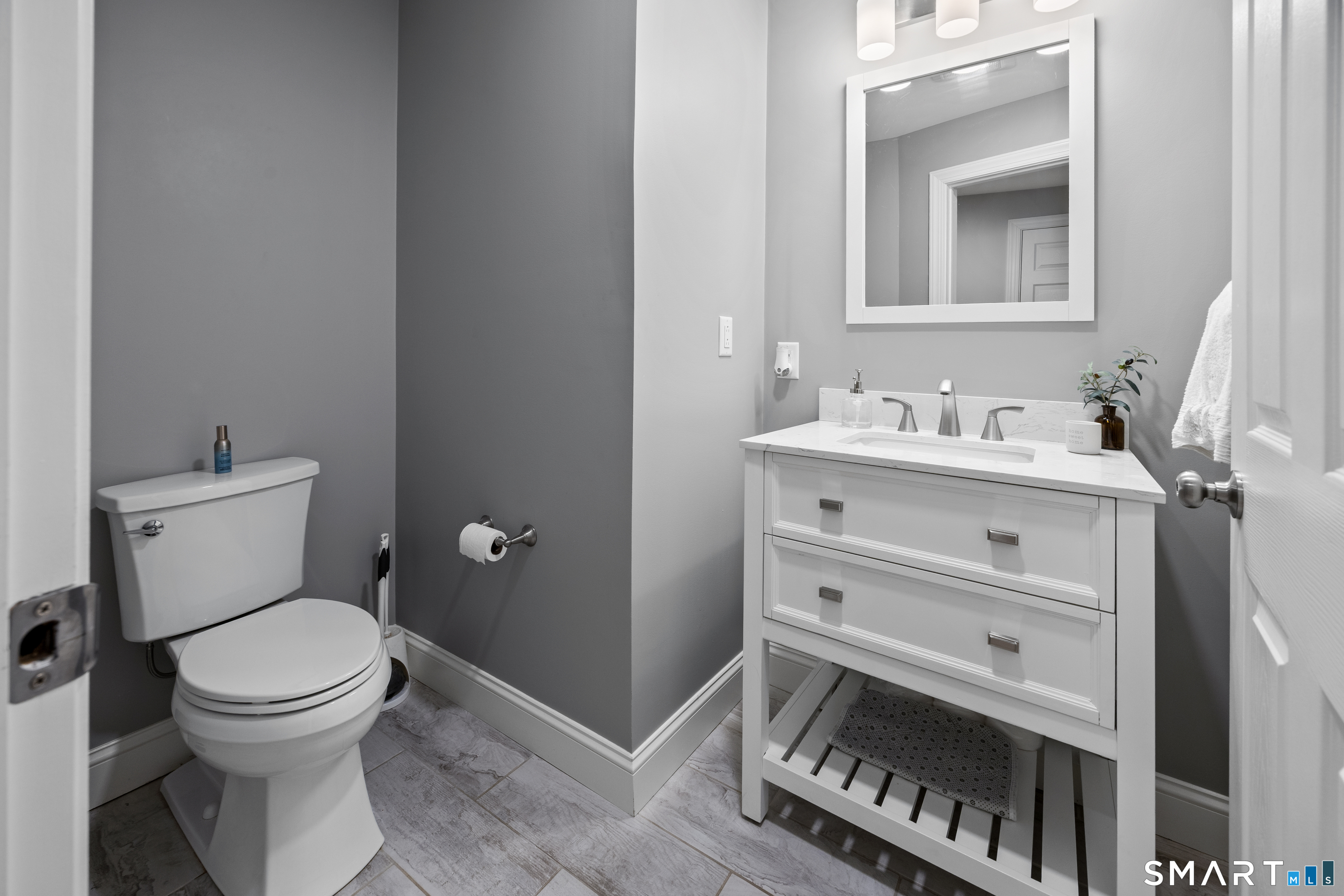 29 Reliance Road Plainville, CT 06062 - Photo 17 of 25 a bathroom with a toilet a sink and mirror