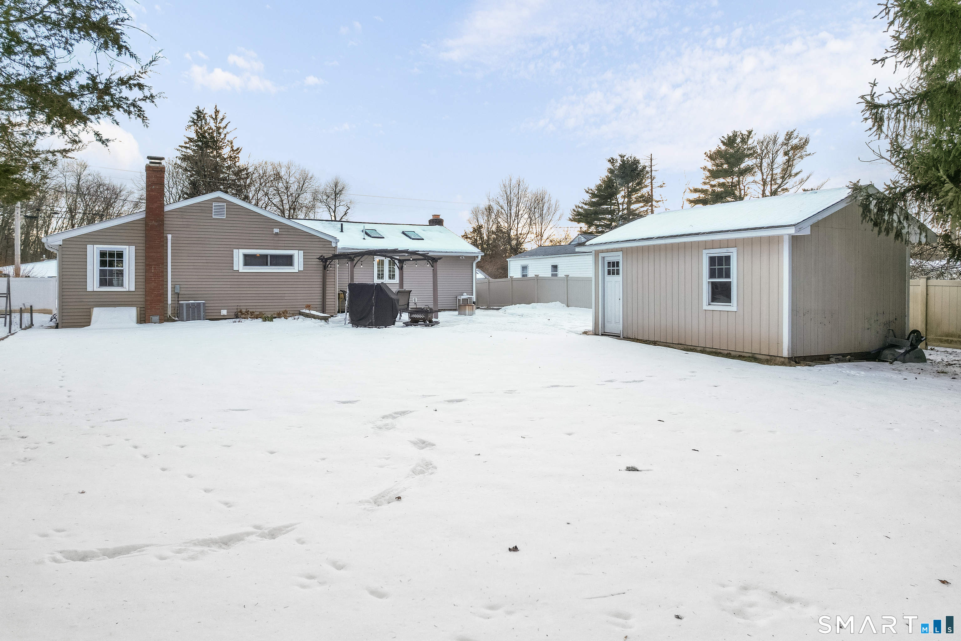 29 Reliance Road Plainville, CT 06062 - Photo 22 of 25 a front view of a house with a yard covered in snow