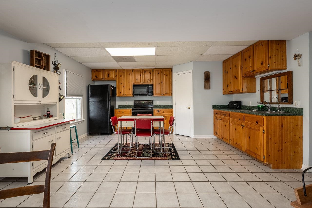 4970 Spring Creek Road Bridgewater, VA 22812 - Photo 54 of 75 a kitchen with stainless steel appliances a stove a sink cabinets and a dining table