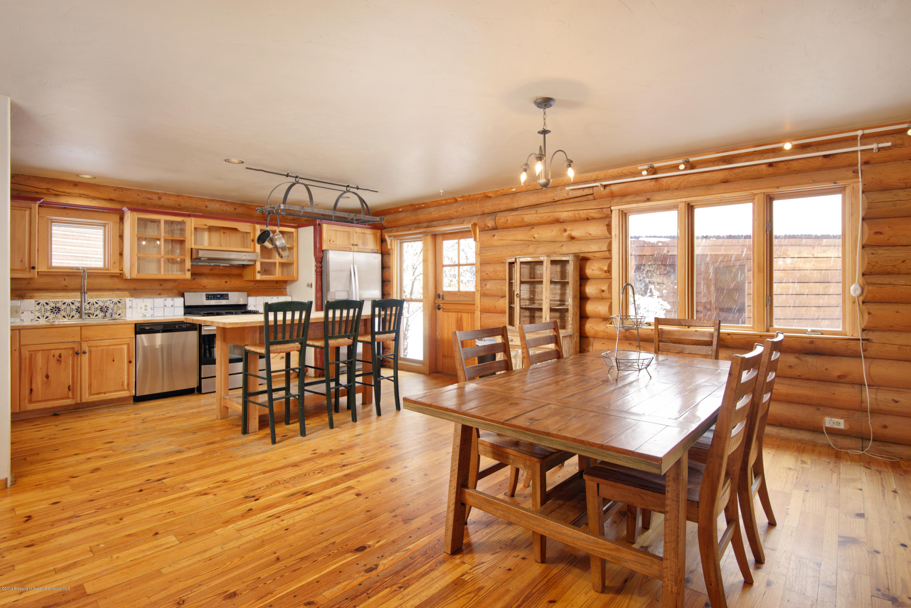 175 Village Court Basalt, CO 81621 - Photo 1 of 25 a dining room with furniture window and wooden floor