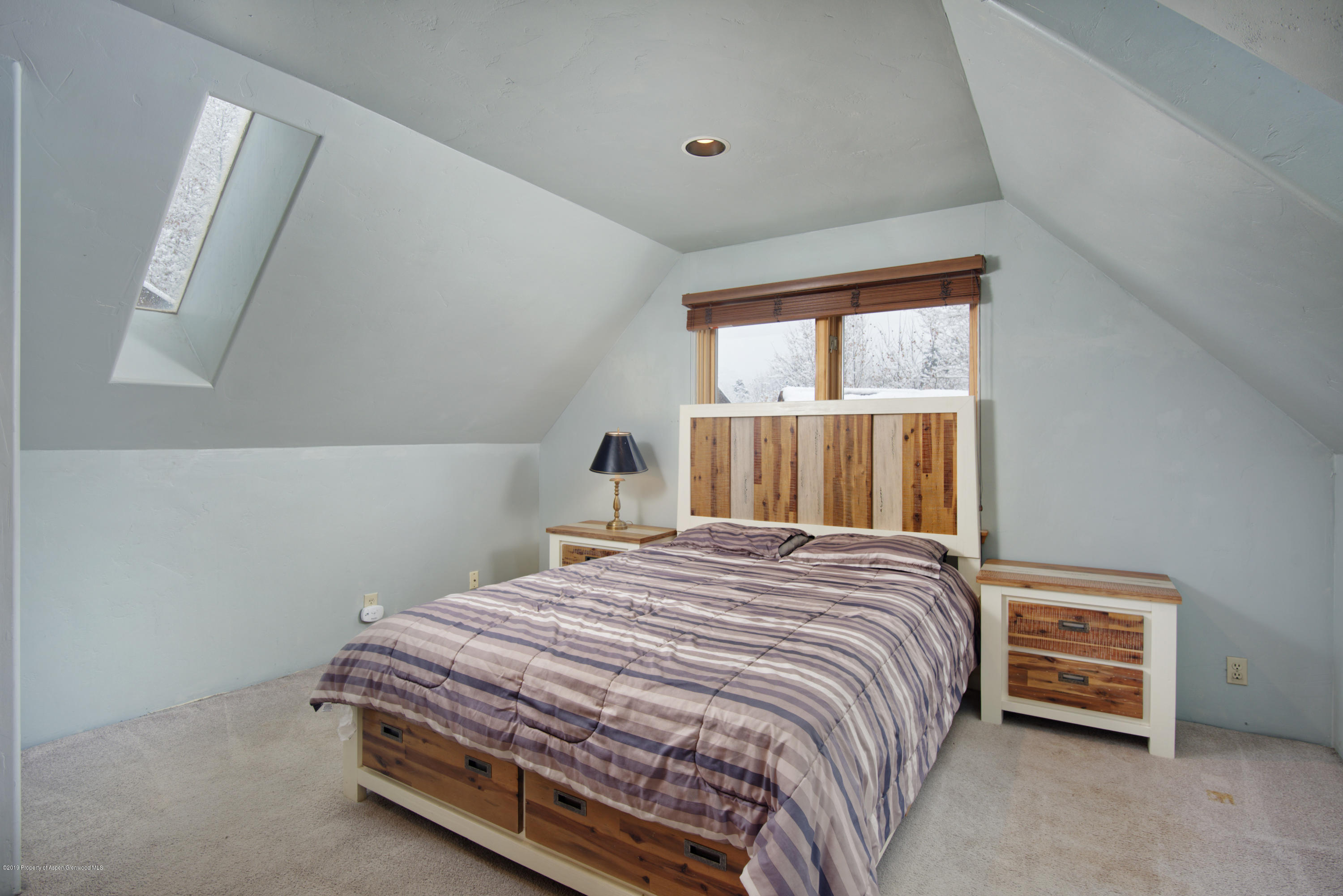 175 Village Court Basalt, CO 81621 - Photo 11 of 25 a bedroom with a bed and a window