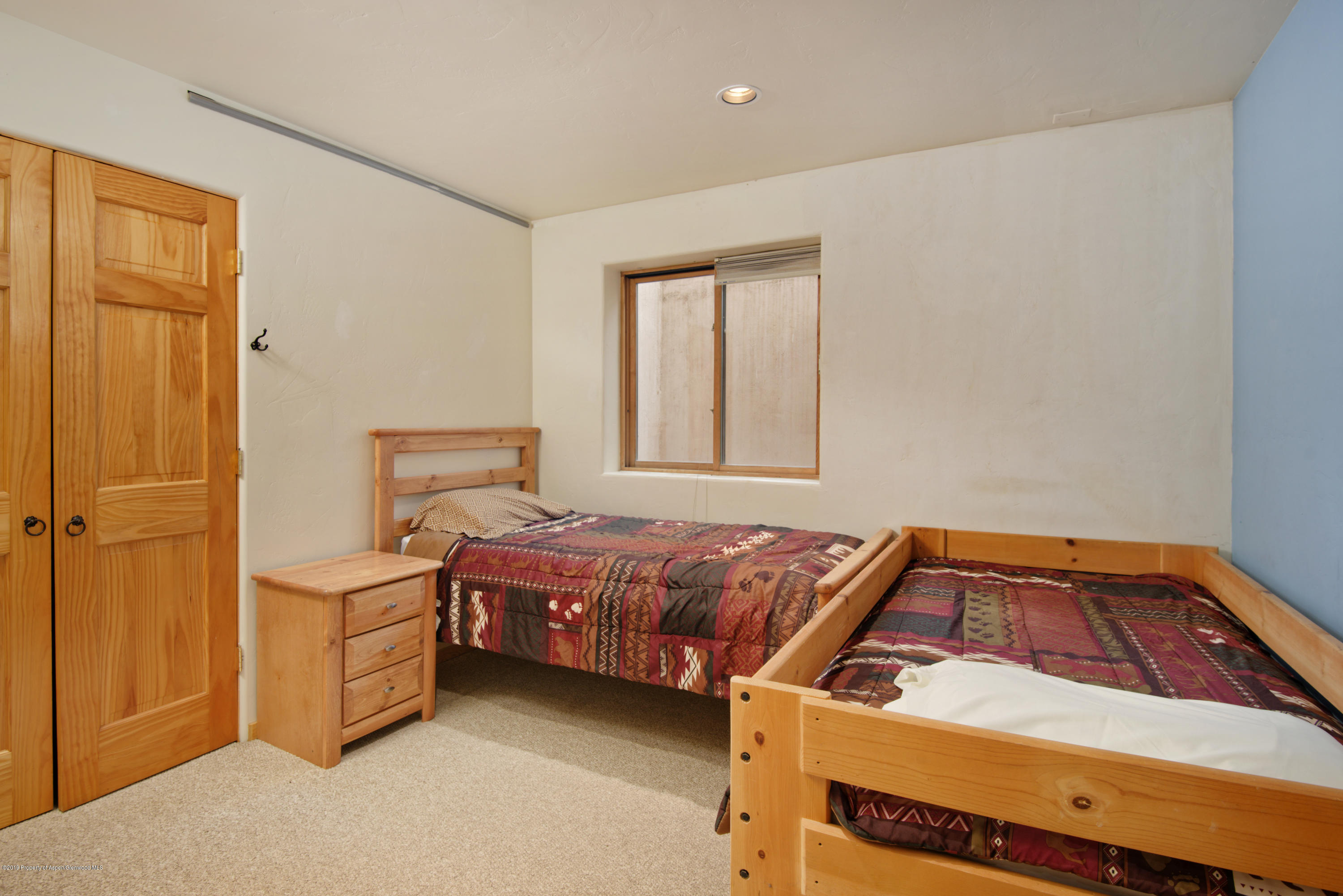 175 Village Court Basalt, CO 81621 - Photo 13 of 25 a bedroom with a bed and a window