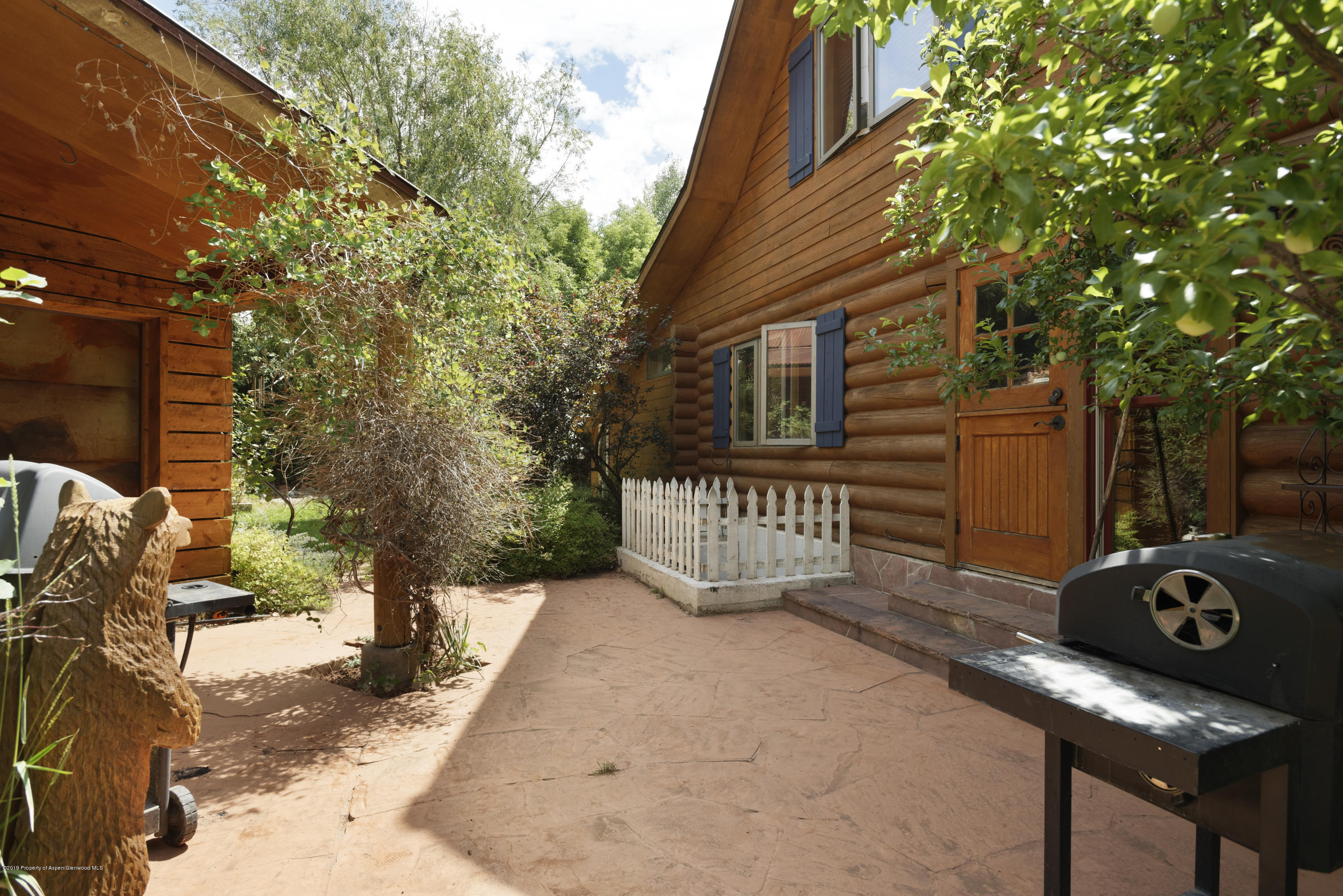 175 Village Court Basalt, CO 81621 - Photo 20 of 25 a view of a deck with a table and chairs and wooden fence