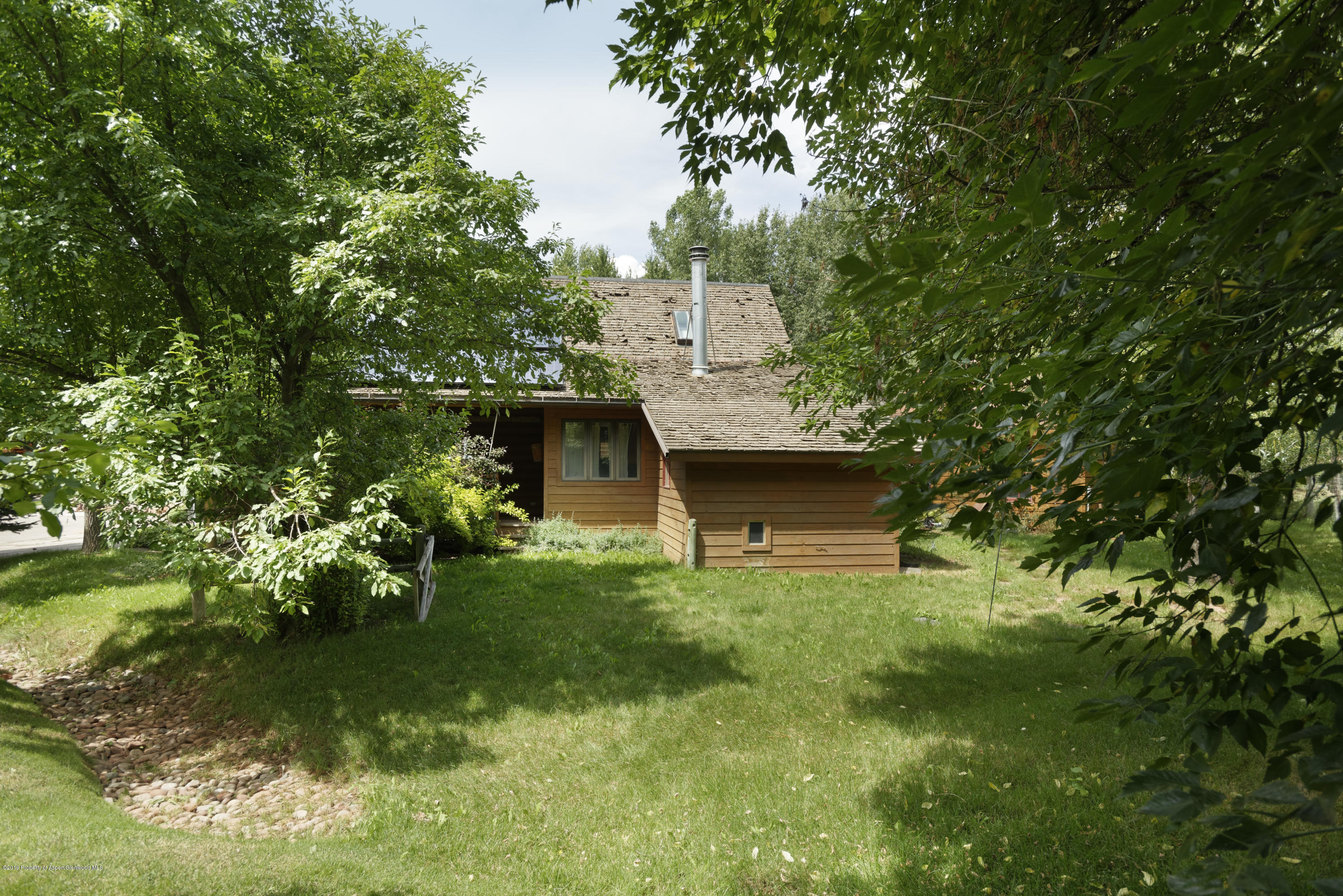 175 Village Court Basalt, CO 81621 - Photo 24 of 25 a front view of a house with garden