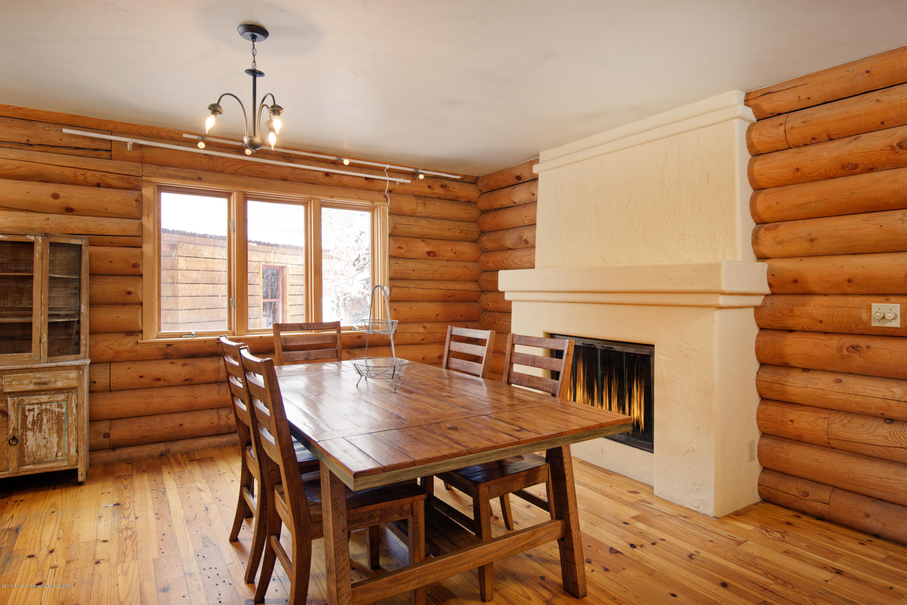 175 Village Court Basalt, CO 81621 - Photo 4 of 25 a dining room with furniture and wooden floor