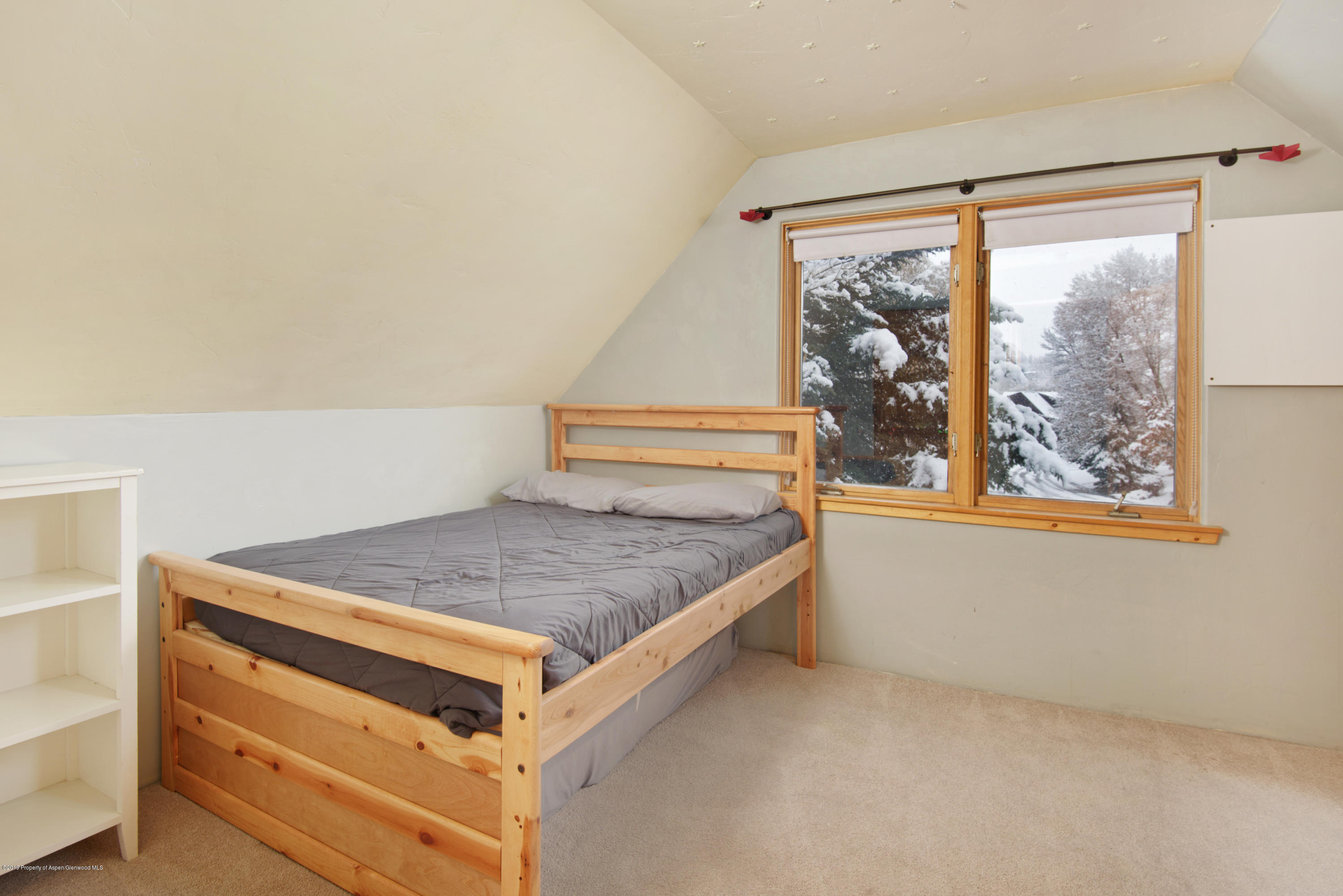 175 Village Court Basalt, CO 81621 - Photo 6 of 25 a room with a bed and a window