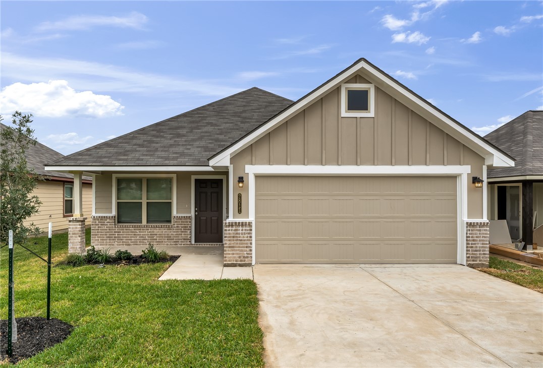 1236 High Street Navasota, TX 77868 - Photo 1 of 14 a front view of a house with a yard and garage