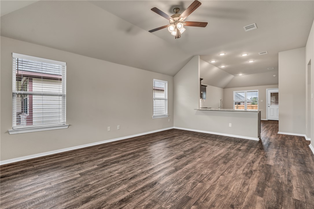 1236 High Street Navasota, TX 77868 - Photo 3 of 14 a view of an empty room with window and wooden floor