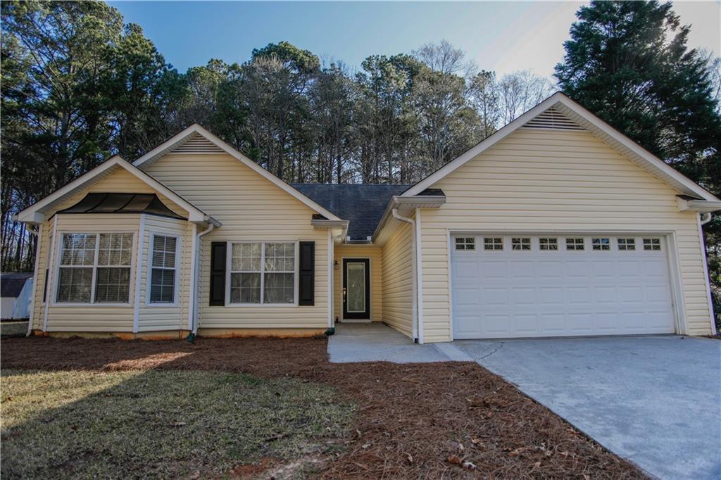 456 Cedar Ridge Drive Winder, GA 30680 - Photo 1 of 1 a view of a house with a yard and garage