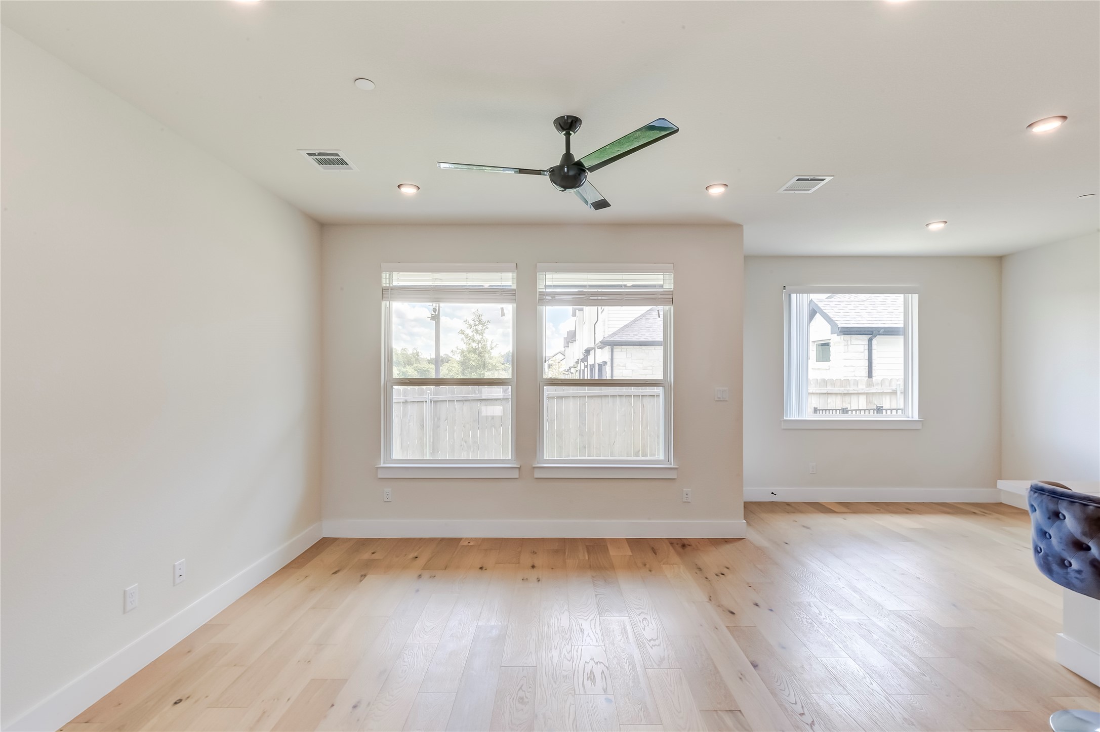 2600 Gattis School Road, Unit 401 Round Rock, TX 78664 - Photo 11 of 29 Empty room with light wood finished floors, a ceiling fan, and recessed lighting