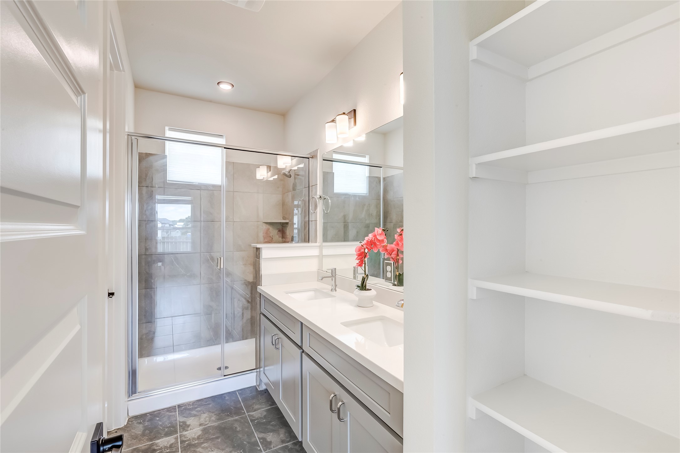 2600 Gattis School Road, Unit 401 Round Rock, TX 78664 - Photo 21 of 29 Bathroom with double vanity, a closet, and a stall shower