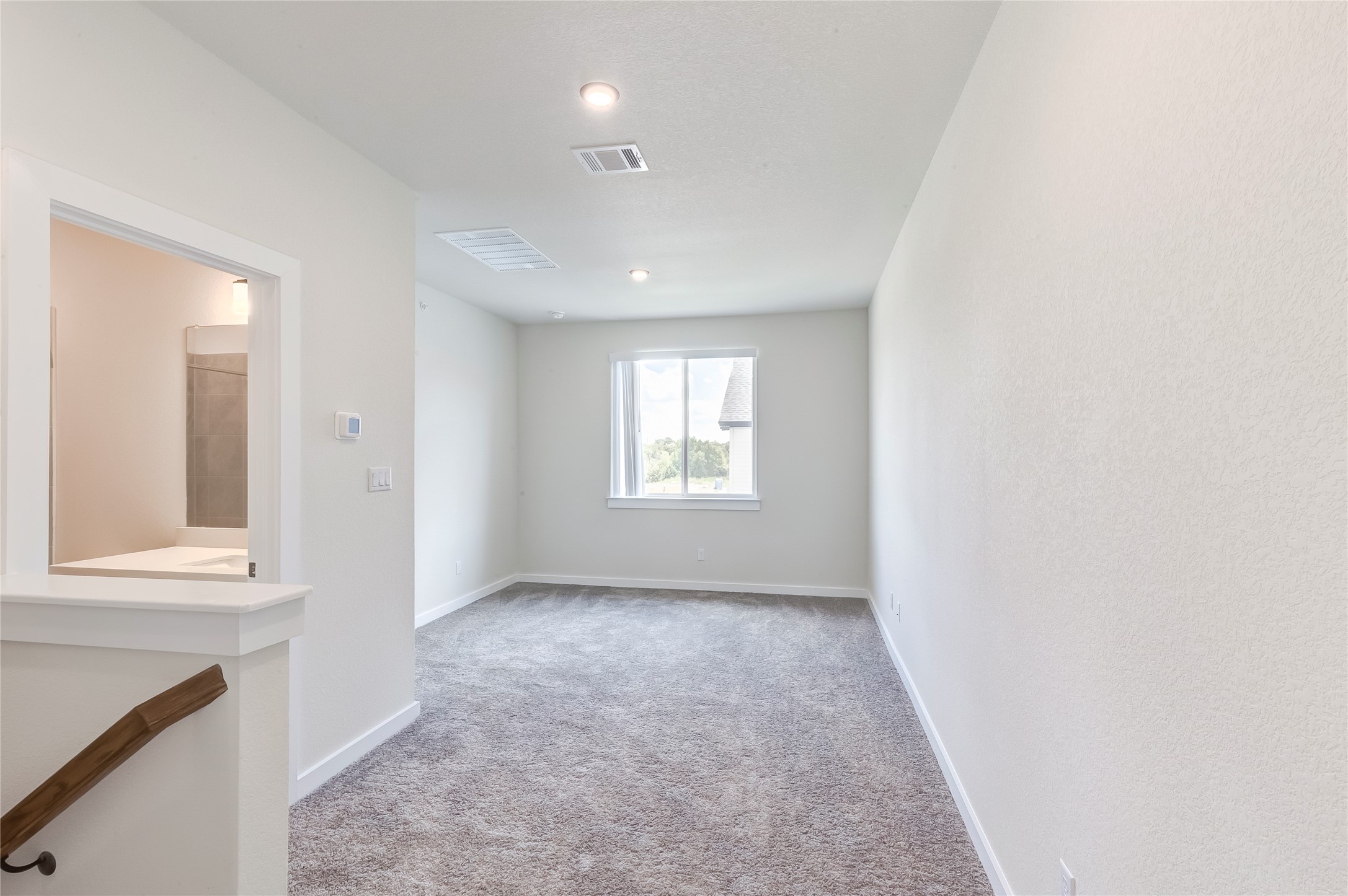 2600 Gattis School Road, Unit 401 Round Rock, TX 78664 - Photo 22 of 29 Spare room with light carpet and baseboards