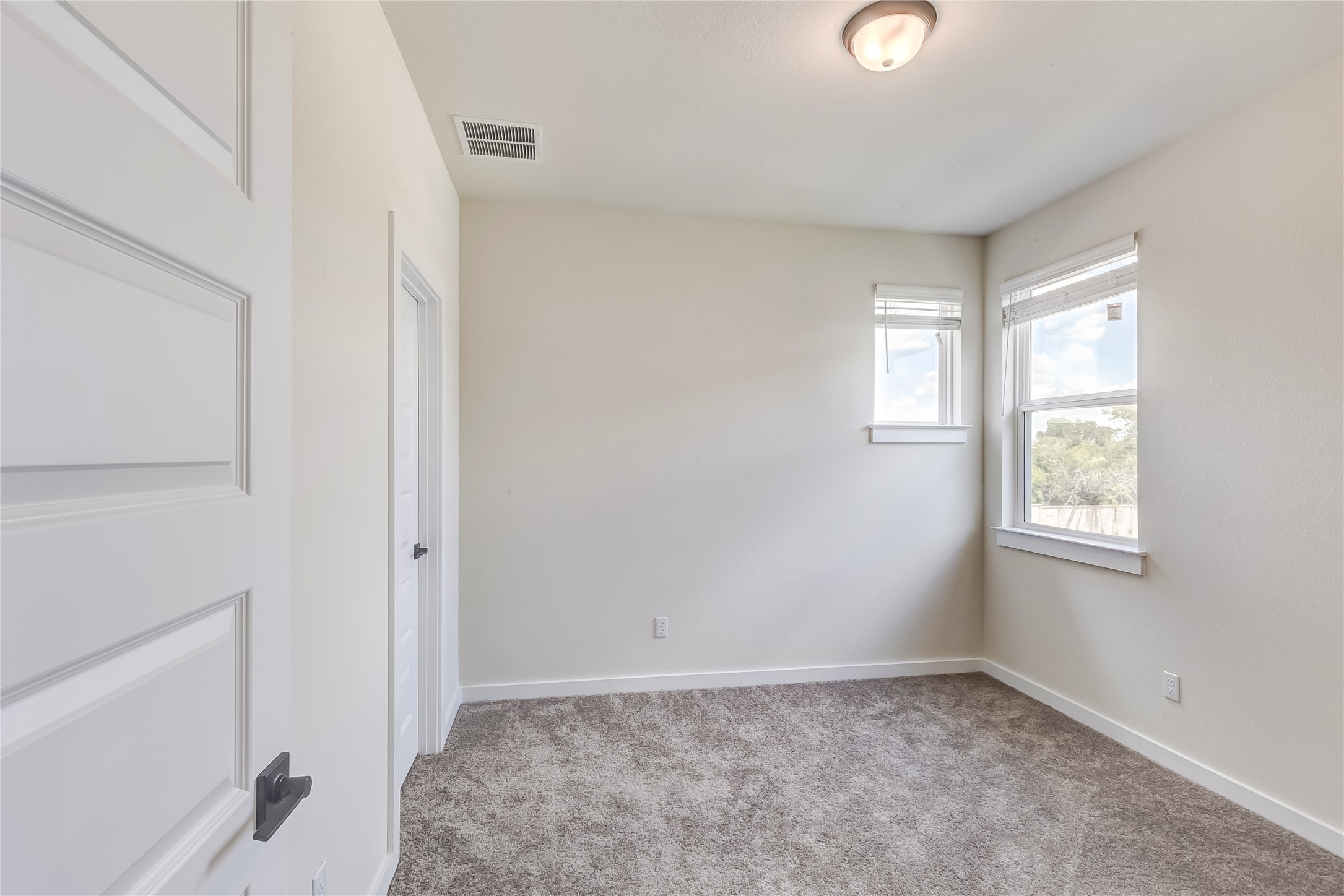 2600 Gattis School Road, Unit 401 Round Rock, TX 78664 - Photo 24 of 29 Empty room featuring light carpet and baseboards