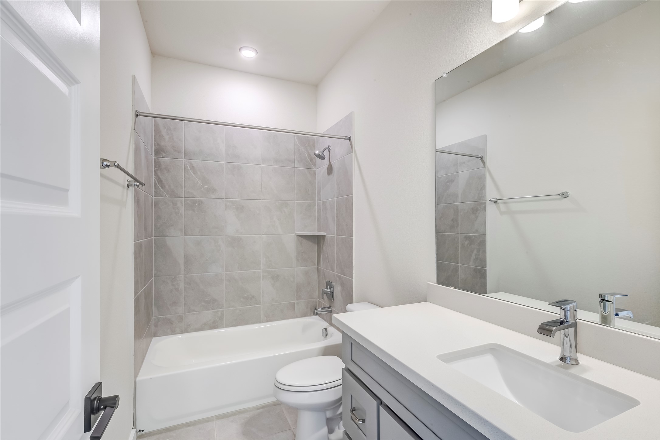 2600 Gattis School Road, Unit 401 Round Rock, TX 78664 - Photo 25 of 29 Bathroom featuring vanity, shower / washtub combination, and light tile patterned flooring