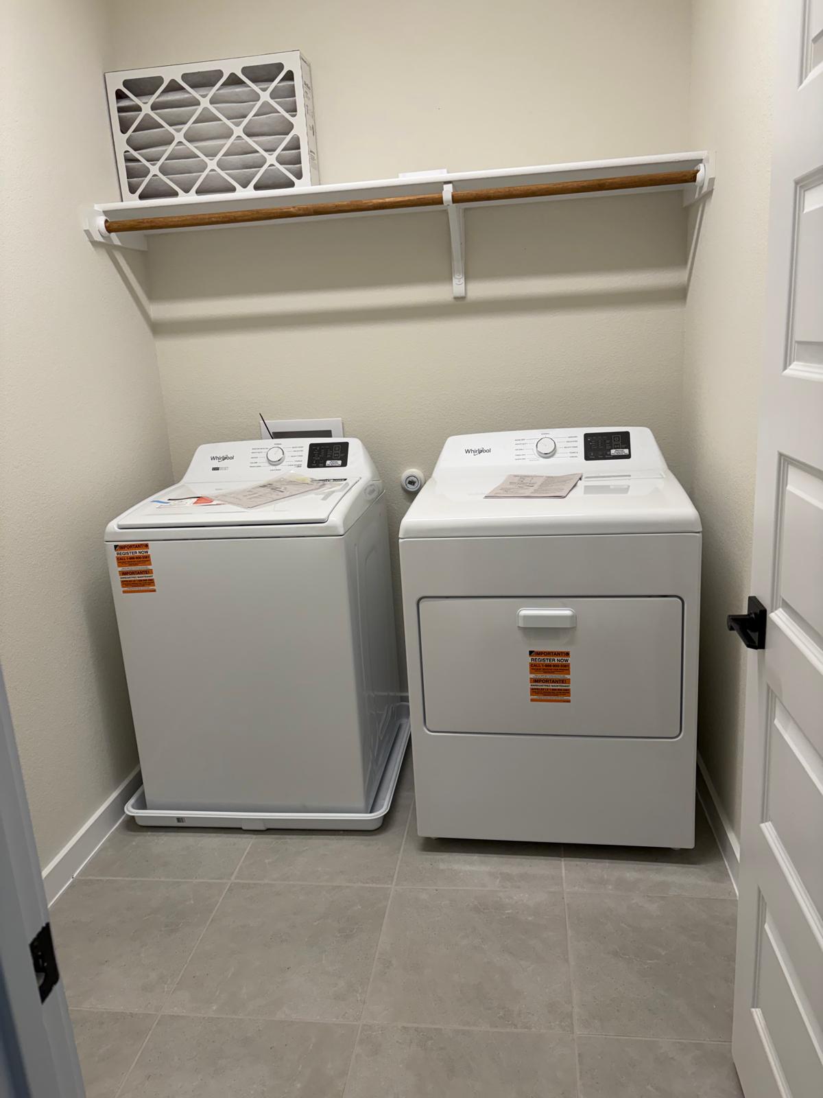2600 Gattis School Road, Unit 401 Round Rock, TX 78664 - Photo 26 of 29 Laundry area featuring washing machine and clothes dryer and light tile patterned flooring