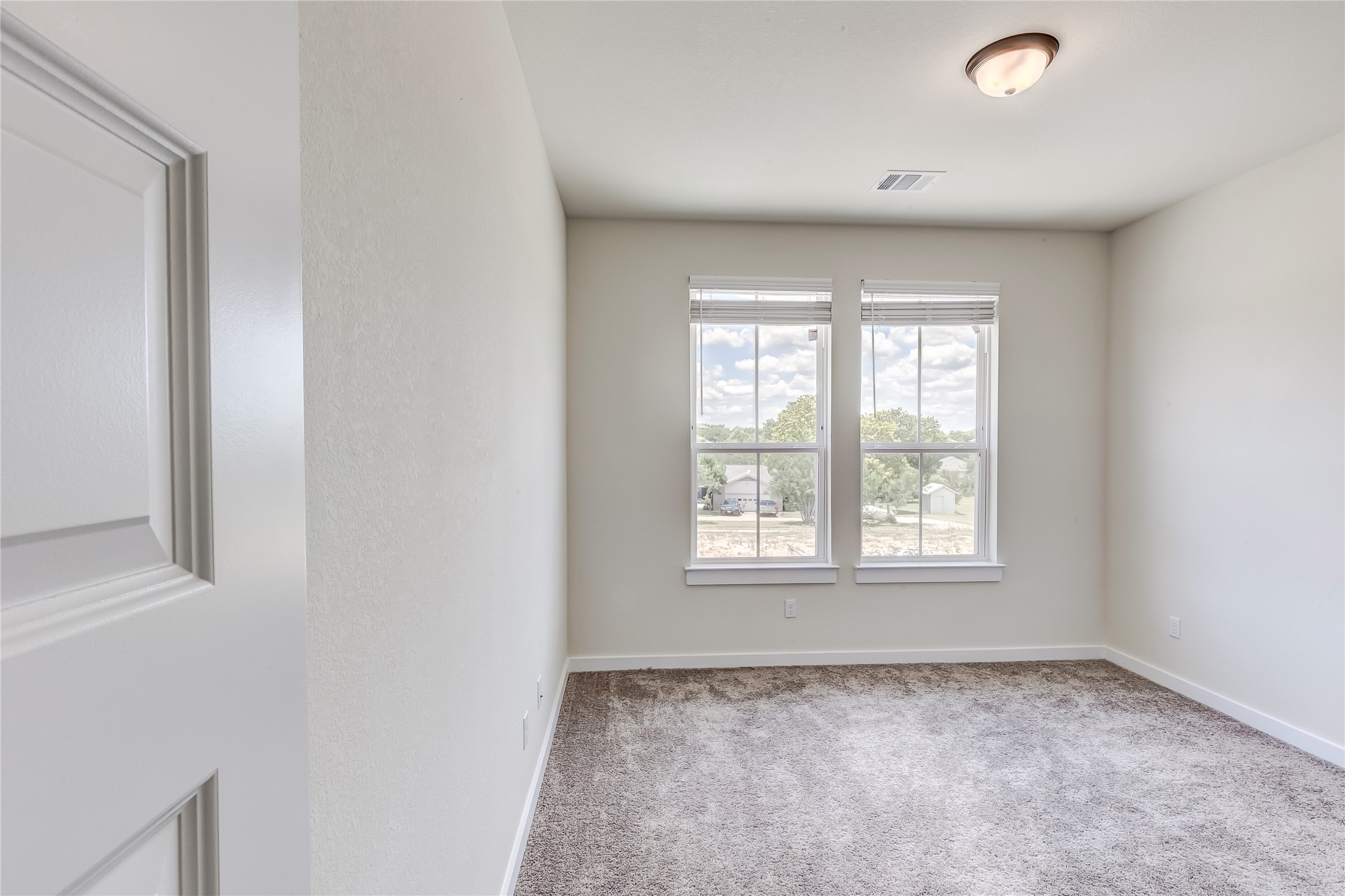 2600 Gattis School Road, Unit 401 Round Rock, TX 78664 - Photo 27 of 29 Unfurnished room featuring carpet and baseboards
