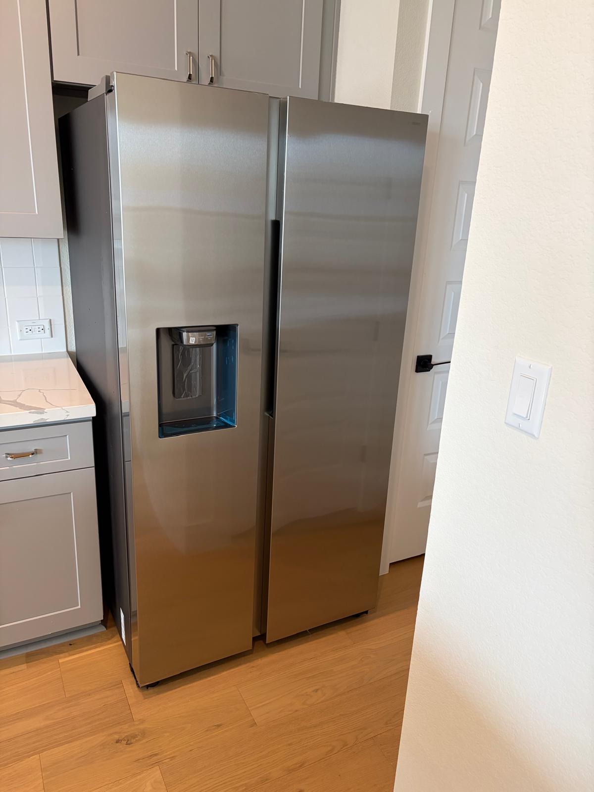 2600 Gattis School Road, Unit 401 Round Rock, TX 78664 - Photo 10 of 29 Kitchen featuring stainless steel refrigerator with ice dispenser, light wood finished floors, light stone countertops, and gray cabinets