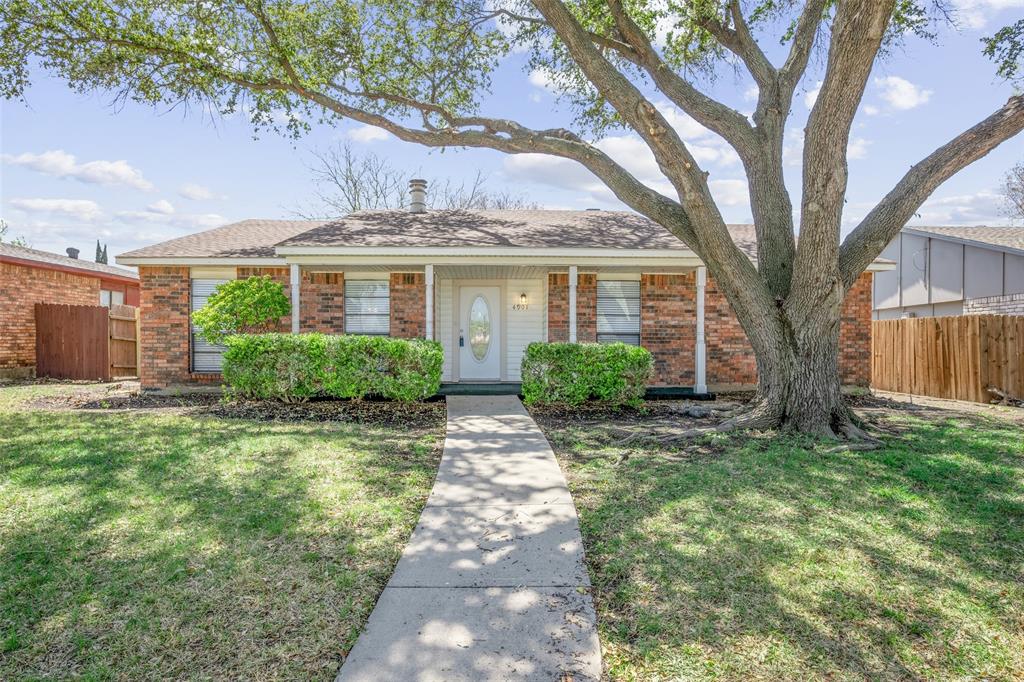 4901 North Colony Boulevard The Colony, TX 75056 - Photo 1 of 1 a view of a front of house with a tree in front of it