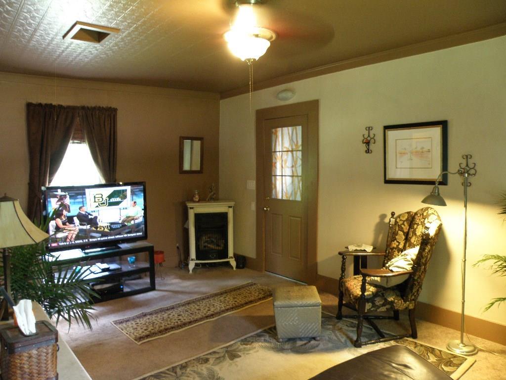 197 Tannery Loop Ellsworth, ME 04605 - Photo 10 of 34 Family room has wall to wall carpet-...