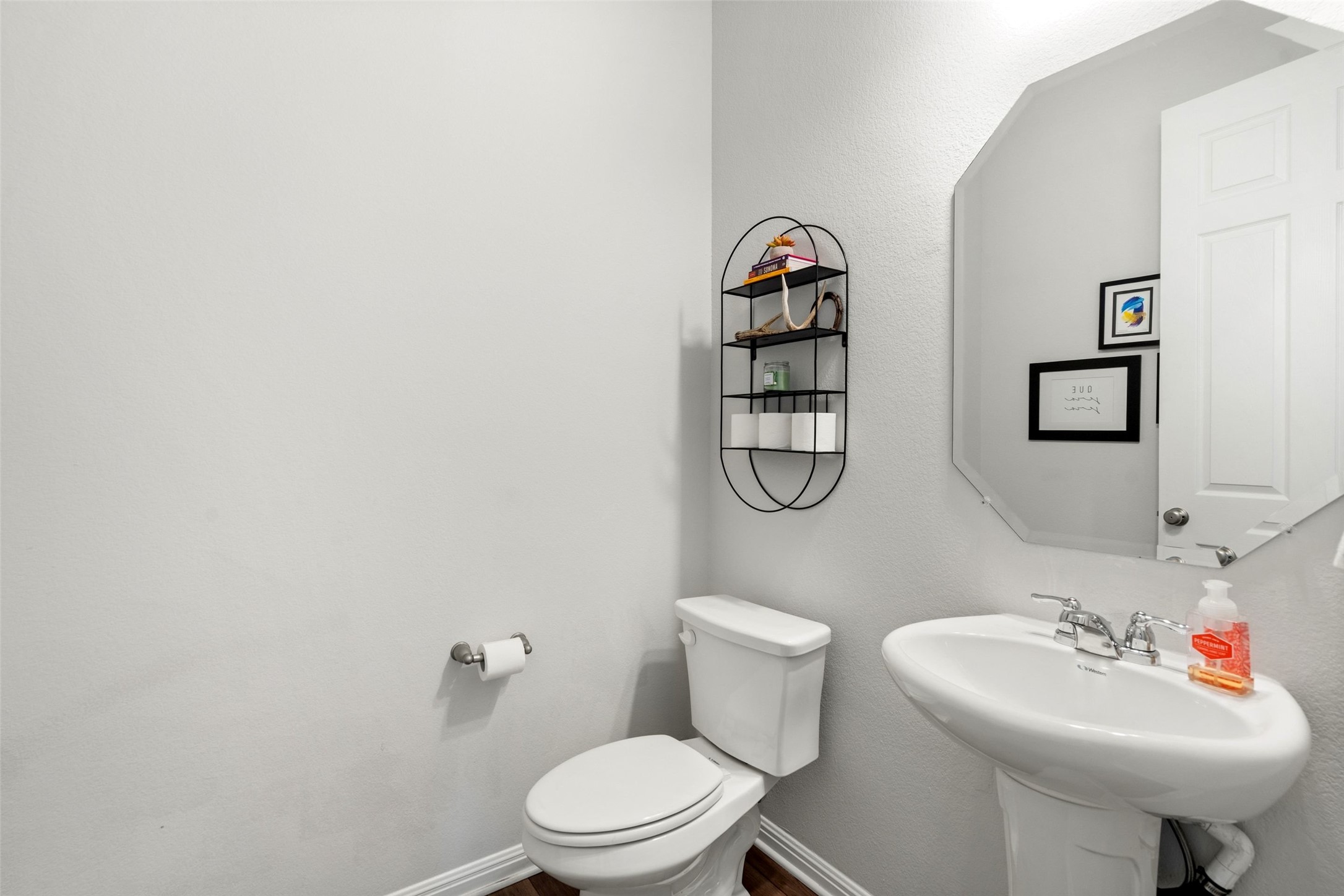 162 Lunar Loop Austin, TX 78737 - Photo 25 of 40 a bathroom with a sink toilet and a mirror