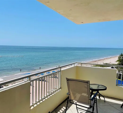 a view of a swimming pool with a lounge chair