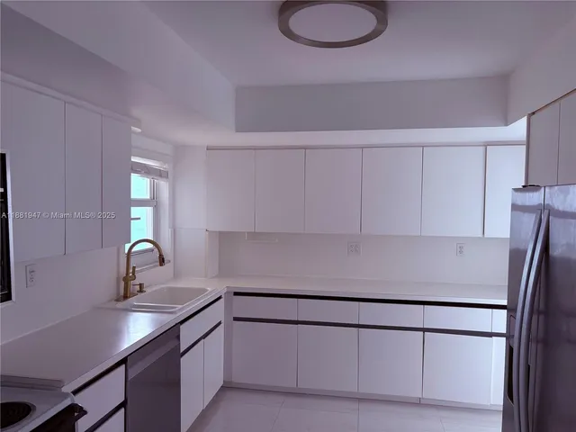 a view of an empty room and a window