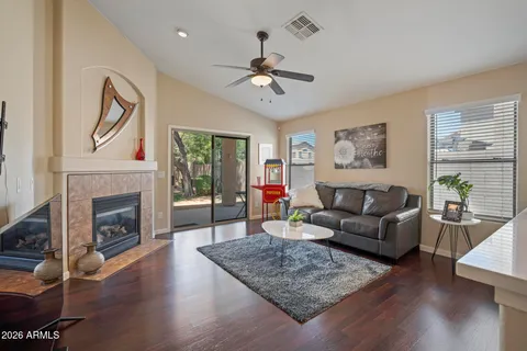 a living room with furniture and a fireplace