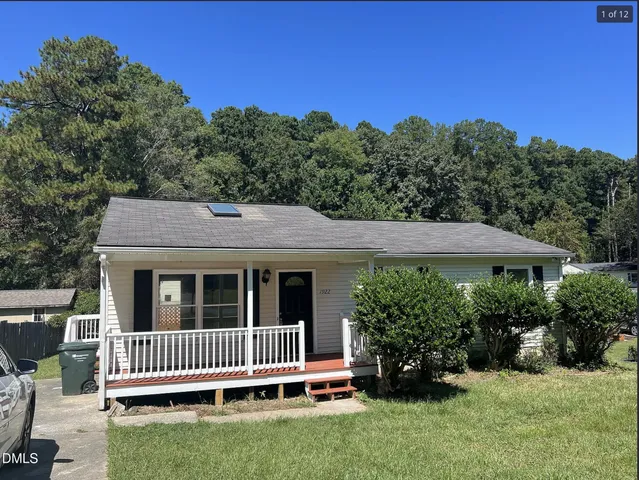 a backyard of a house with a garden