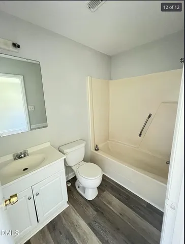 a bathroom with a sink a toilet and a bathtub