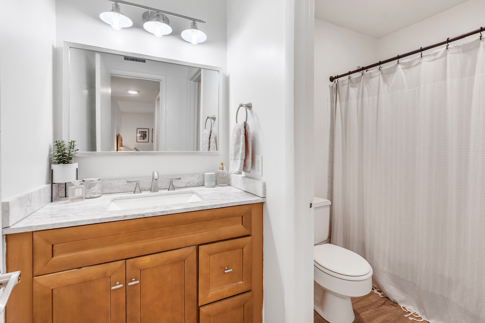 21 Vaughns Gap Road, Unit 88F Nashville, TN 37205 - Photo 21 of 30 a bathroom with a granite countertop sink toilet and mirror