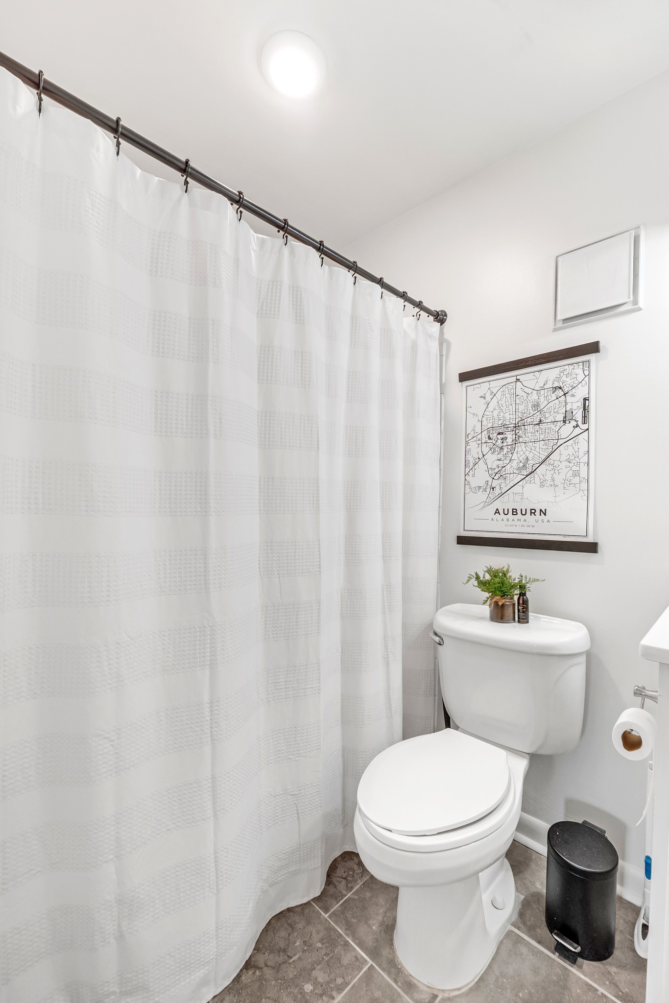 21 Vaughns Gap Road, Unit 88F Nashville, TN 37205 - Photo 25 of 30 a white toilet sitting next to a shower curtain